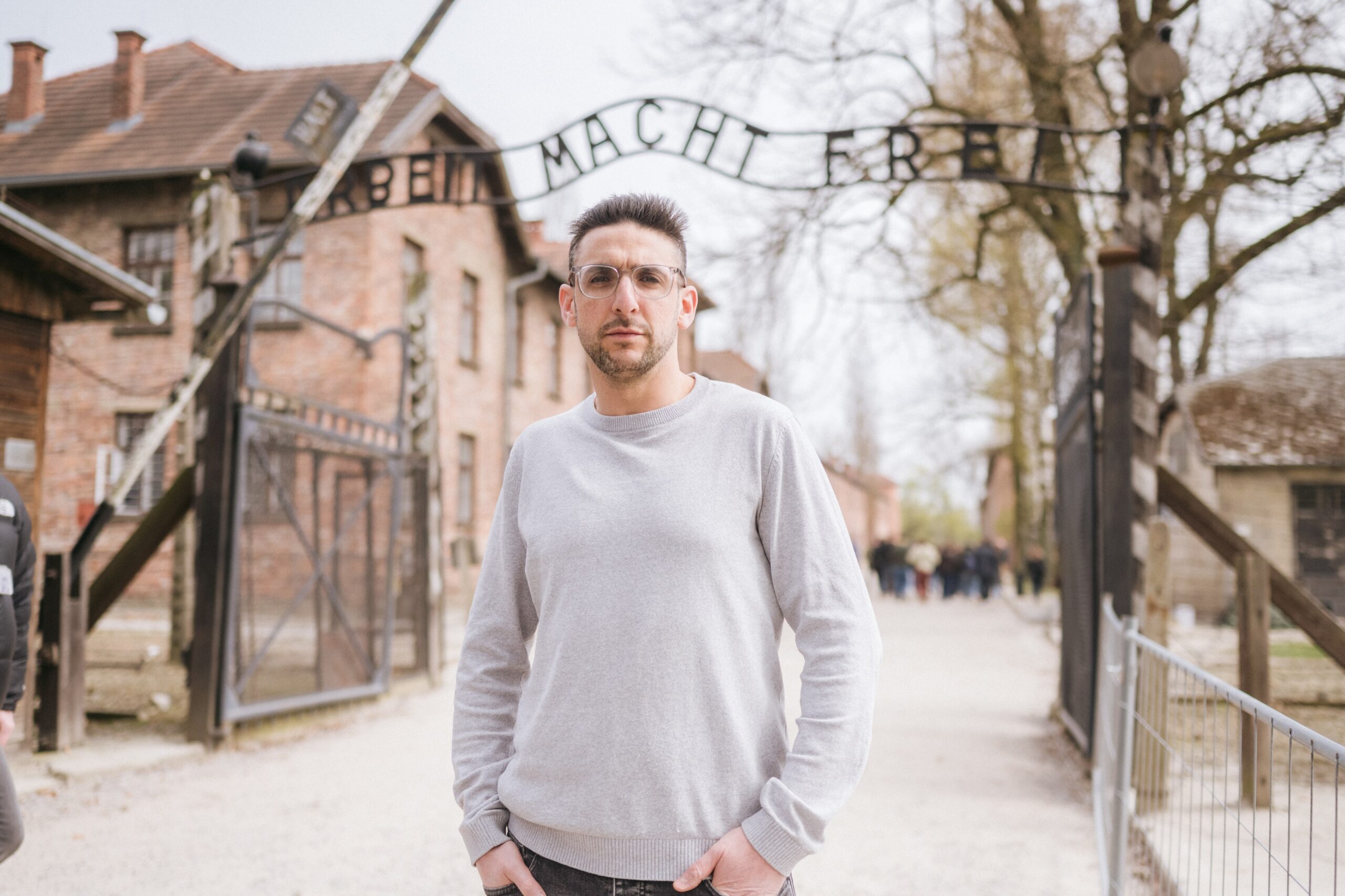 Yoni Finlay at the gate of Auschwitz