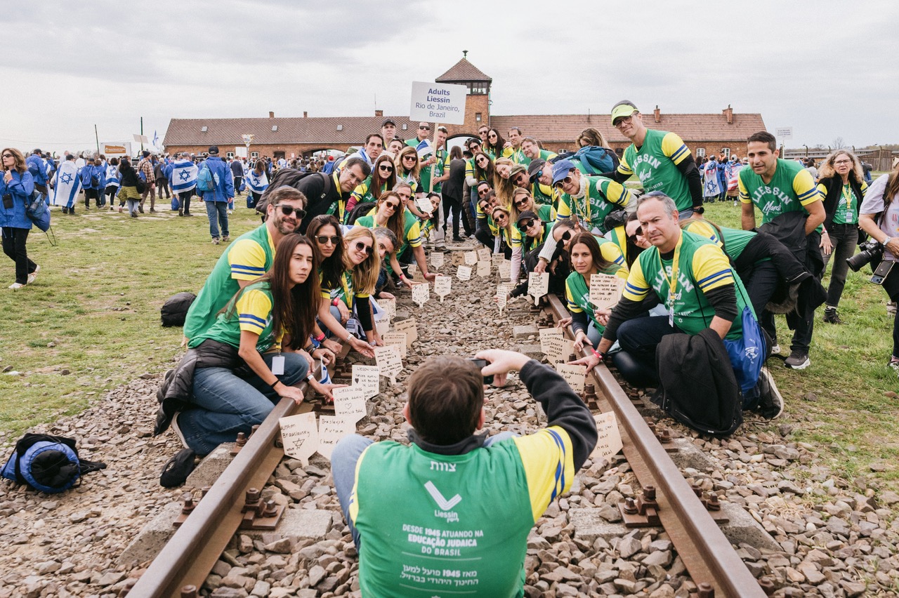 The Brazilian delegation on the railway tracks at Birkenau