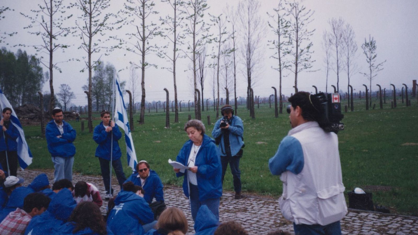Judy Weissenberg Cohen reading to March of the Living participants at Auschwitz-Birkenau