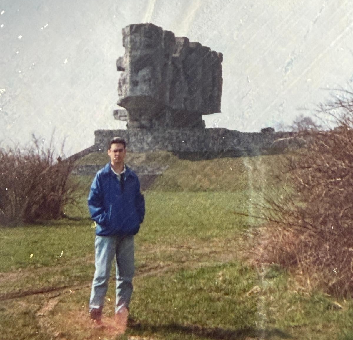 Stephen Sokolow at a memorial monument, 1994