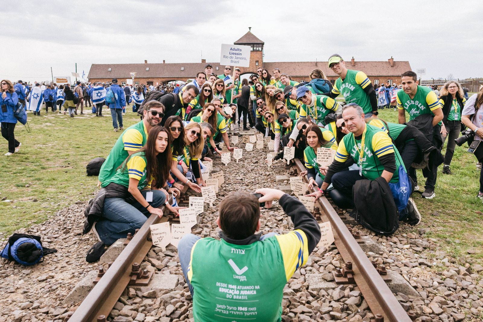 The Brazil Delegation gathered along the railway tracks at Birkenau